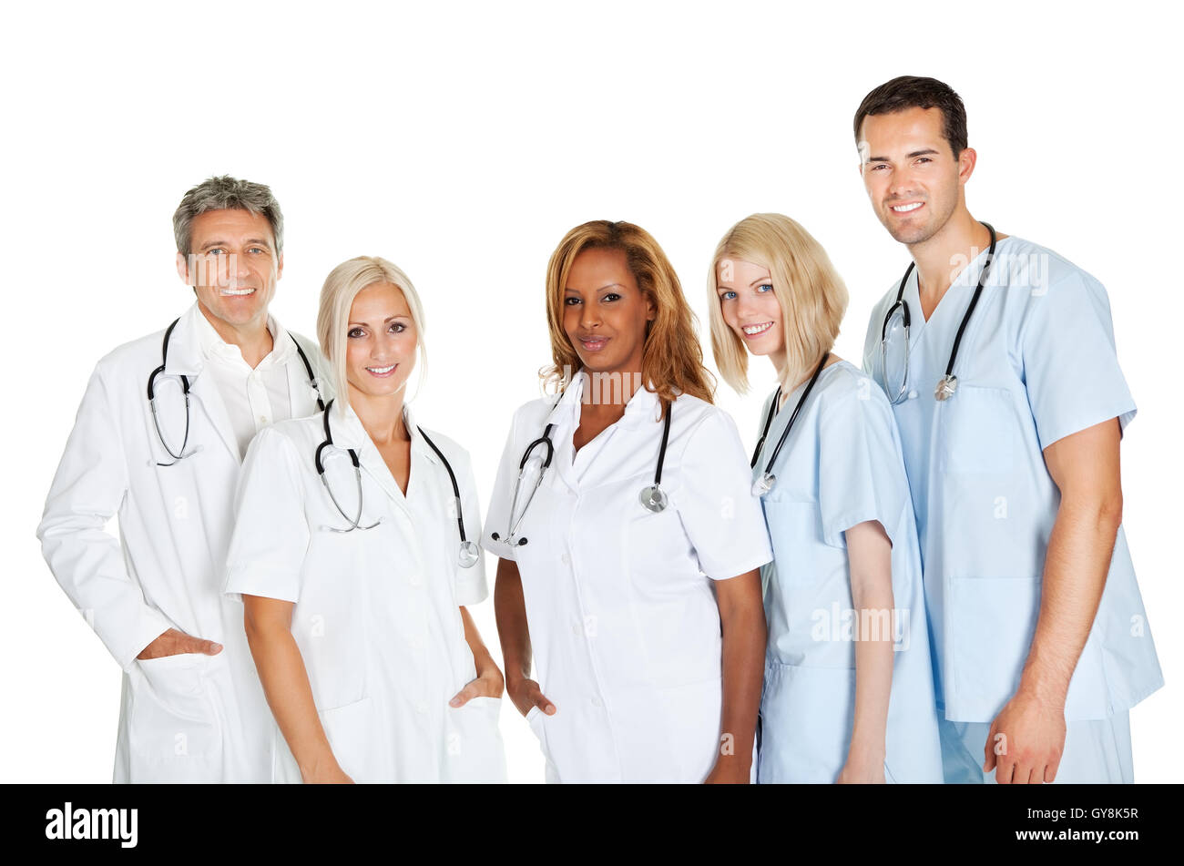 Group of confident doctors standing on white Stock Photo