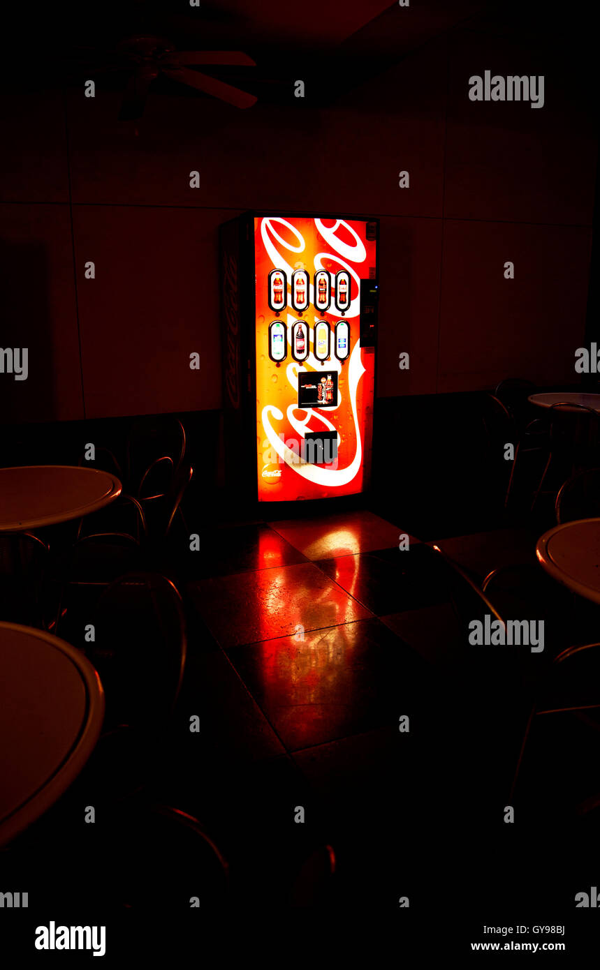 A machine for purchasing Coca Cola soda sits on a covered patio on a college campus, Tucson, Arizona, USA. Stock Photo