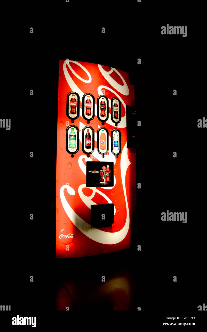 A vending machine offering Coca Cola soda sits on a covered patio on a college campus, Tucson, Arizona, USA. Stock Photo