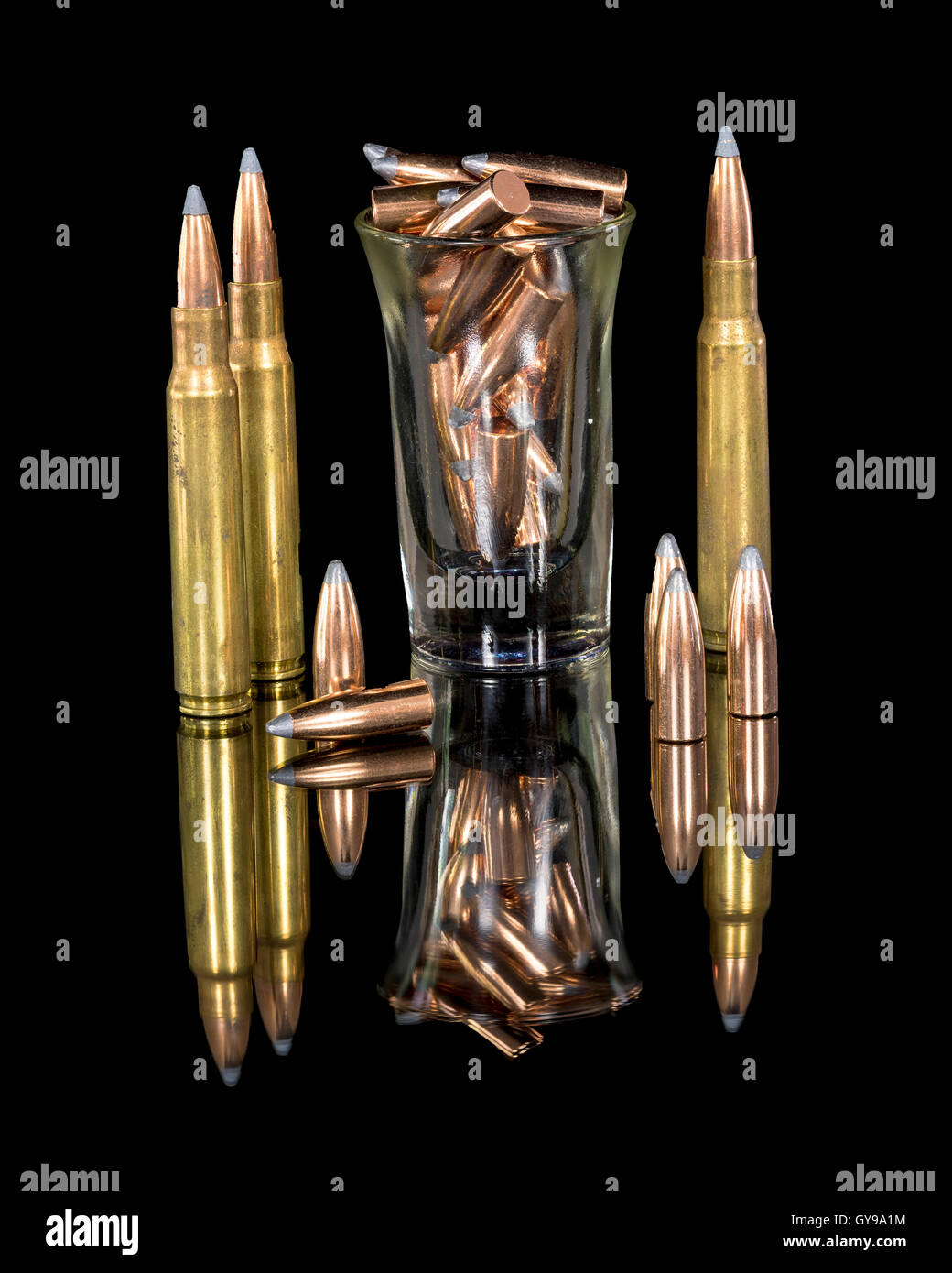 Brass and copper bullets on a reflective surface Stock Photo Alamy