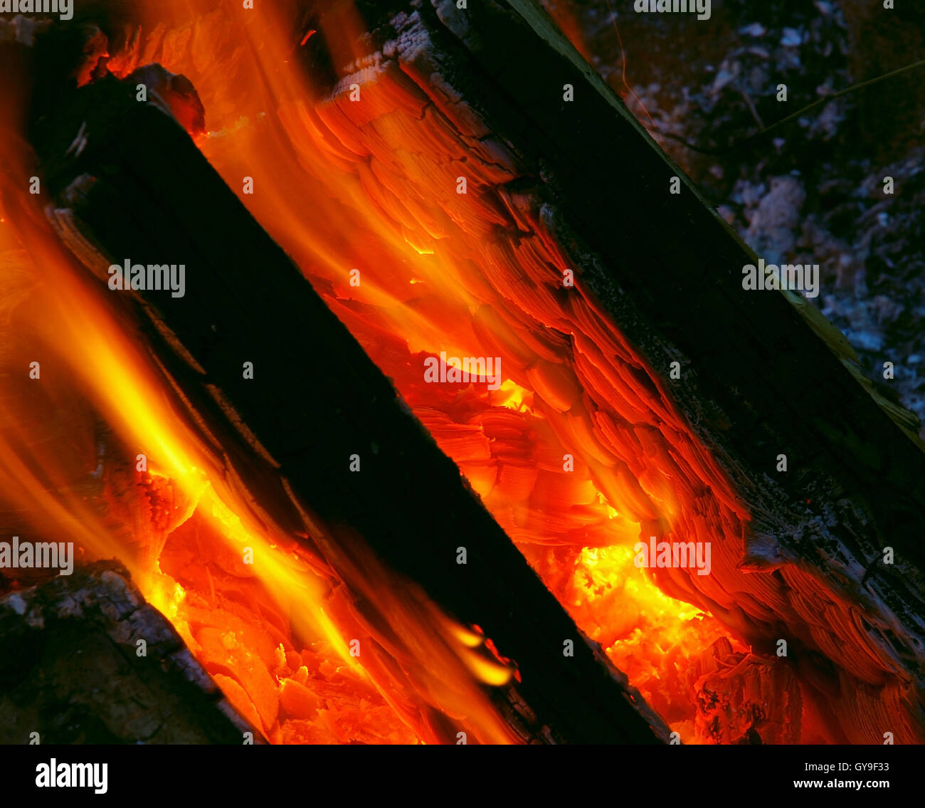 Capturing the Hot Coals glowing on a burning camp fire. Stock Photo