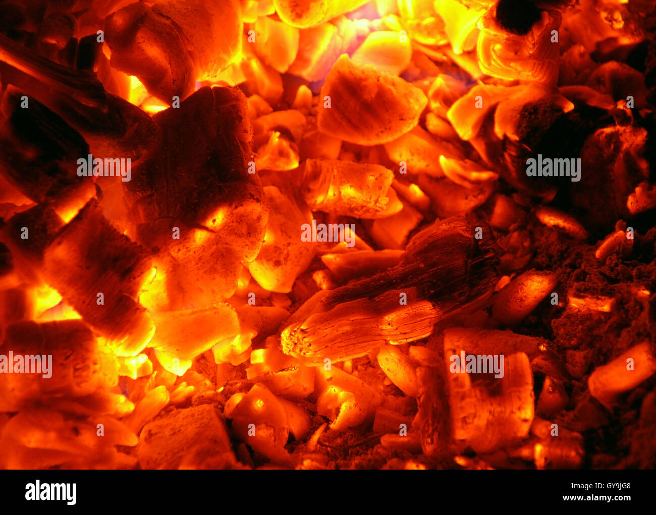 Capturing the Hot Coals glowing on a burning camp fire. Stock Photo