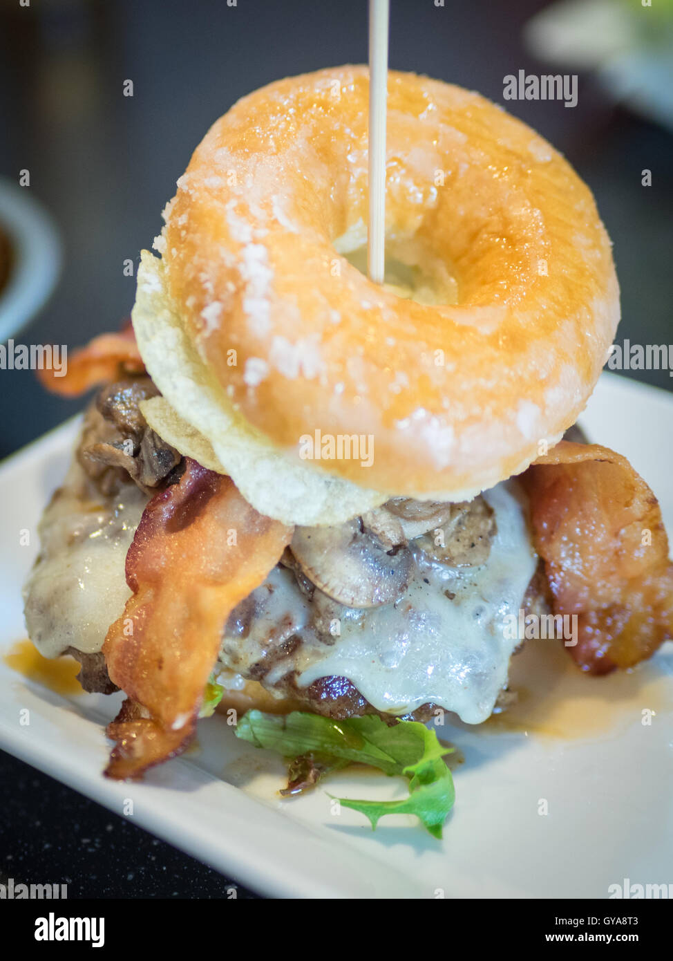 A bacon donut burger (Luther Burger) from Soda Jerks restaurant in
