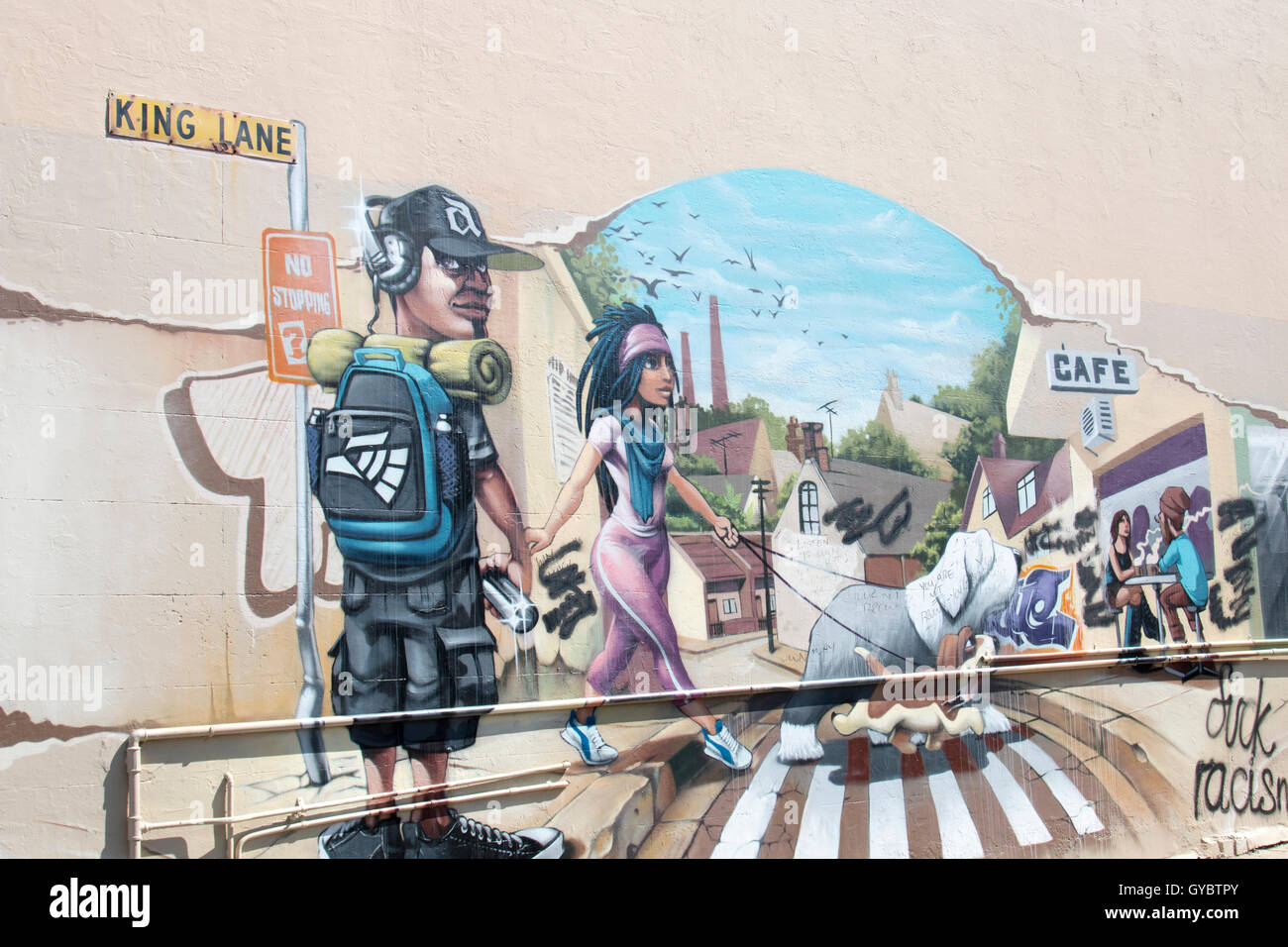 Graffiti street artist painting on a wall in King Lane,Newtown,Sydney