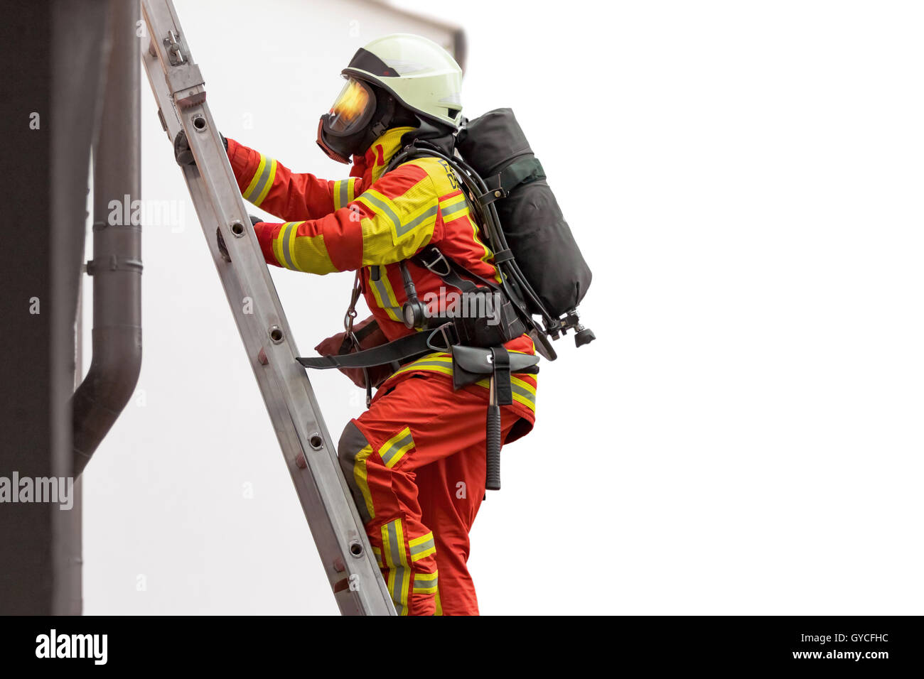Fireman climbing a ladder hires stock photography and images Alamy