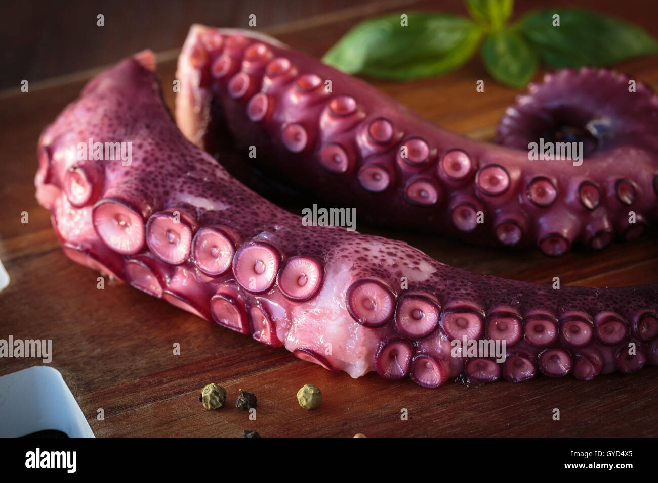 Delicious cooked octopus tentacles on a chopping board Stock Photo - Alamy