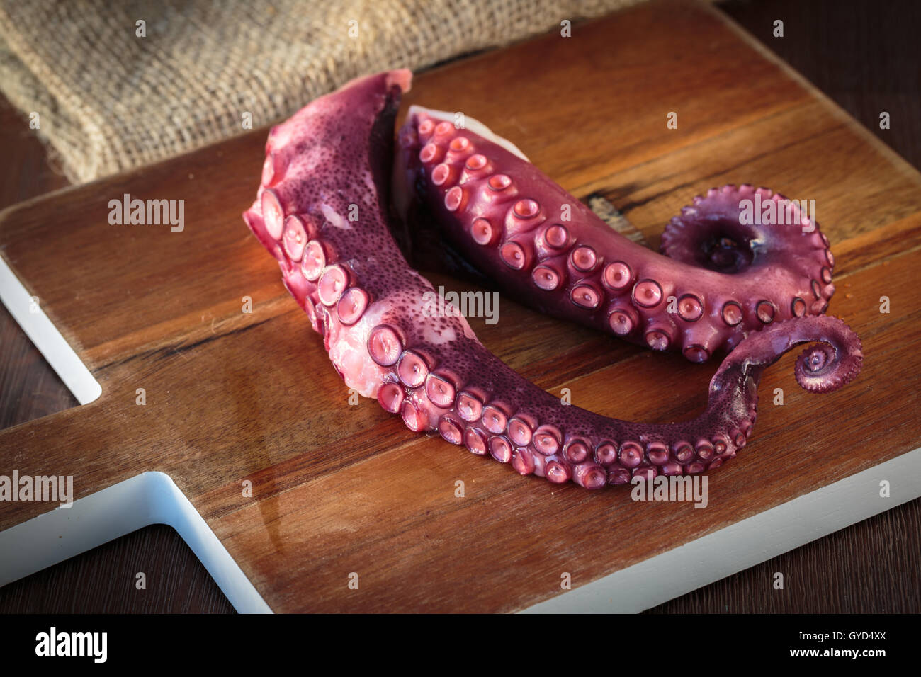 Delicious cooked octopus tentacles on a chopping board Stock Photo - Alamy