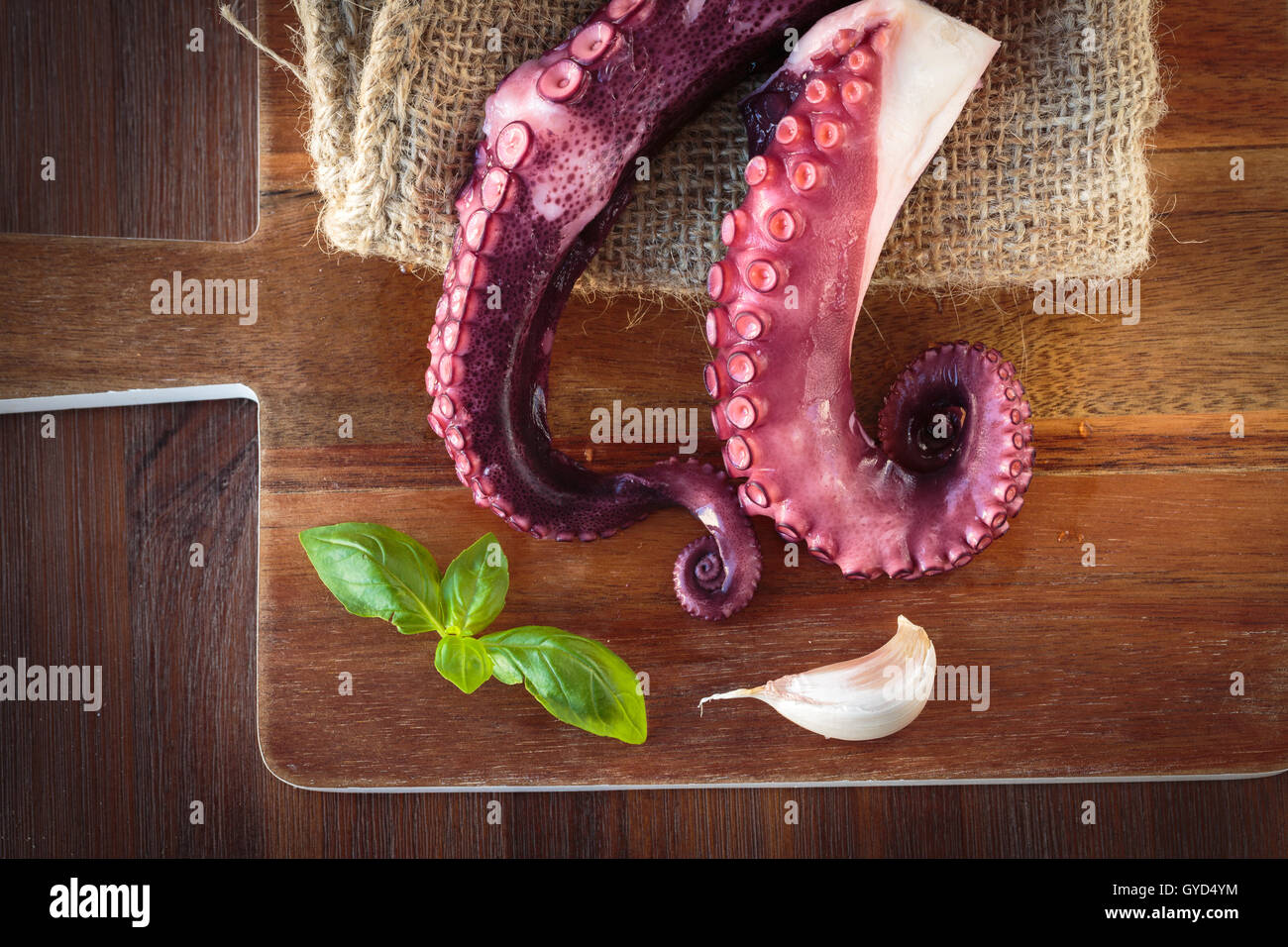 Delicious cooked octopus tentacles on a chopping board Stock Photo - Alamy