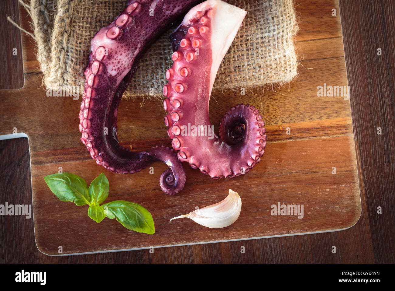 Delicious cooked octopus tentacles on a chopping board Stock Photo - Alamy