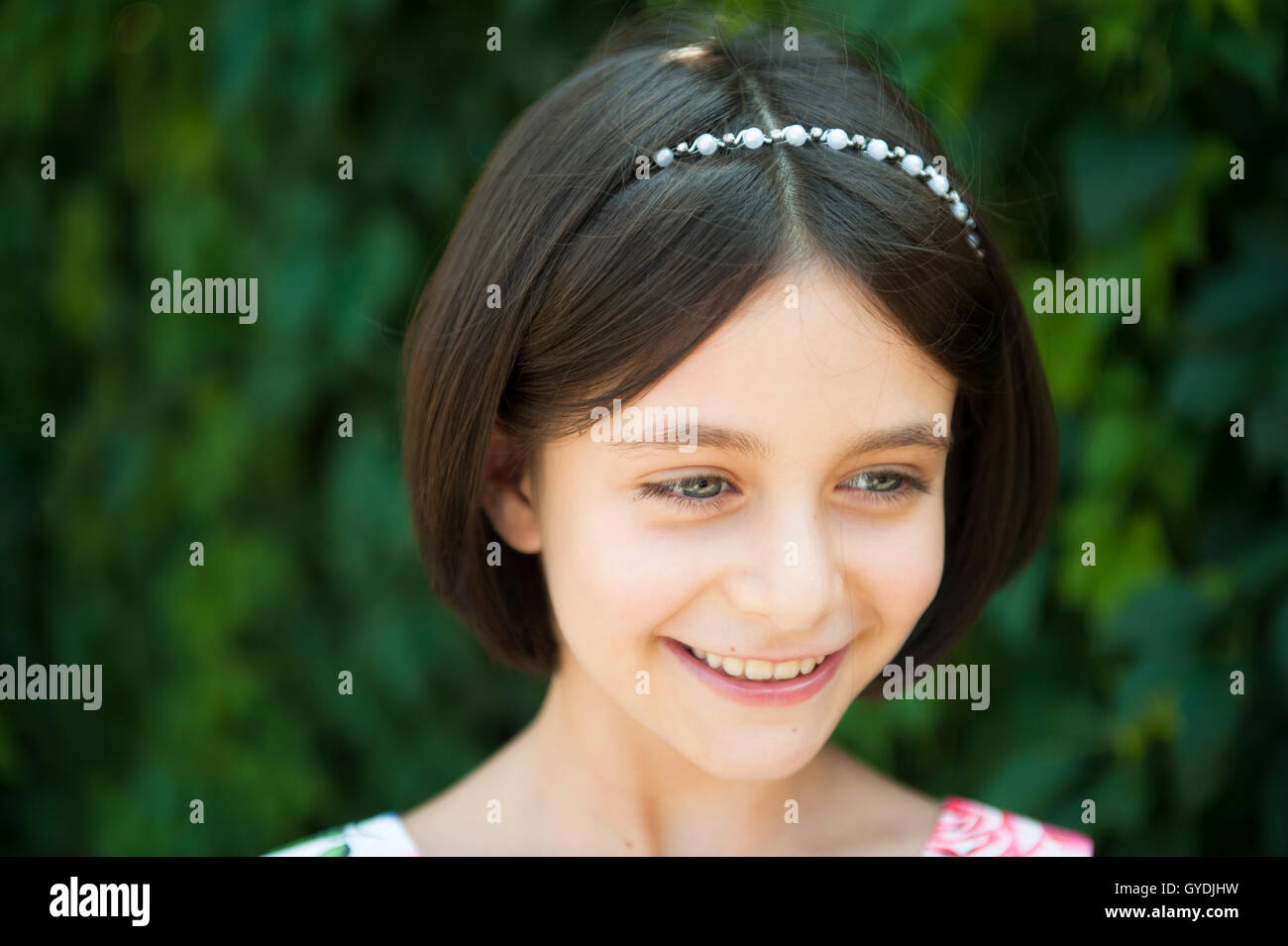 portrait of beautiful little girl smiling looking away Stock Photo - Alamy
