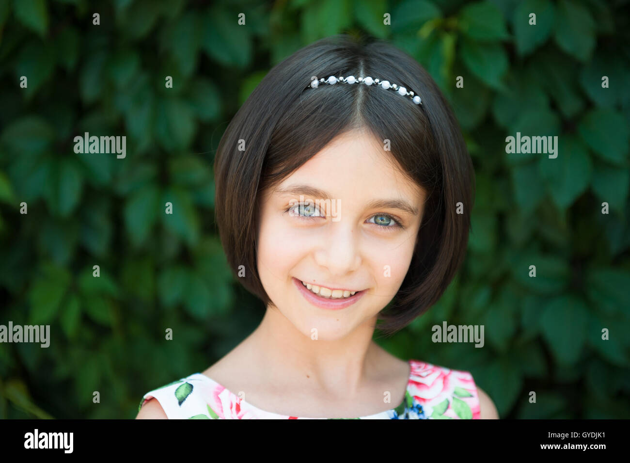 beautiful little girl smiling looking at camera Stock Photo - Alamy