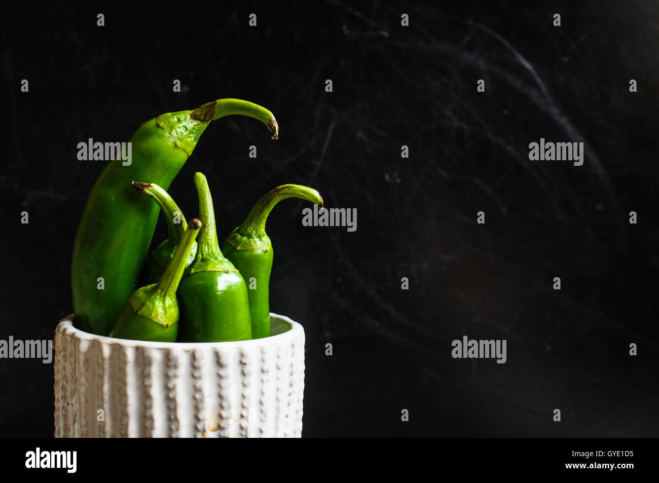 Chili peppers on the old wooden backgroud Stock Photo - Alamy