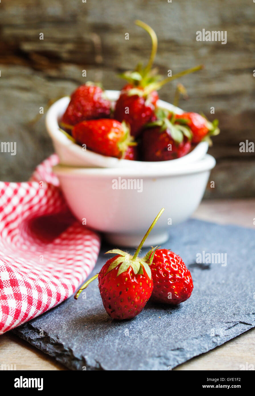 Fresh strawberries on the old wooden background Stock Photo - Alamy