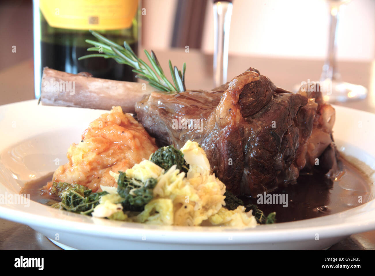 Slow roasted lamb shank with seasonal vegetables Stock Photo Alamy