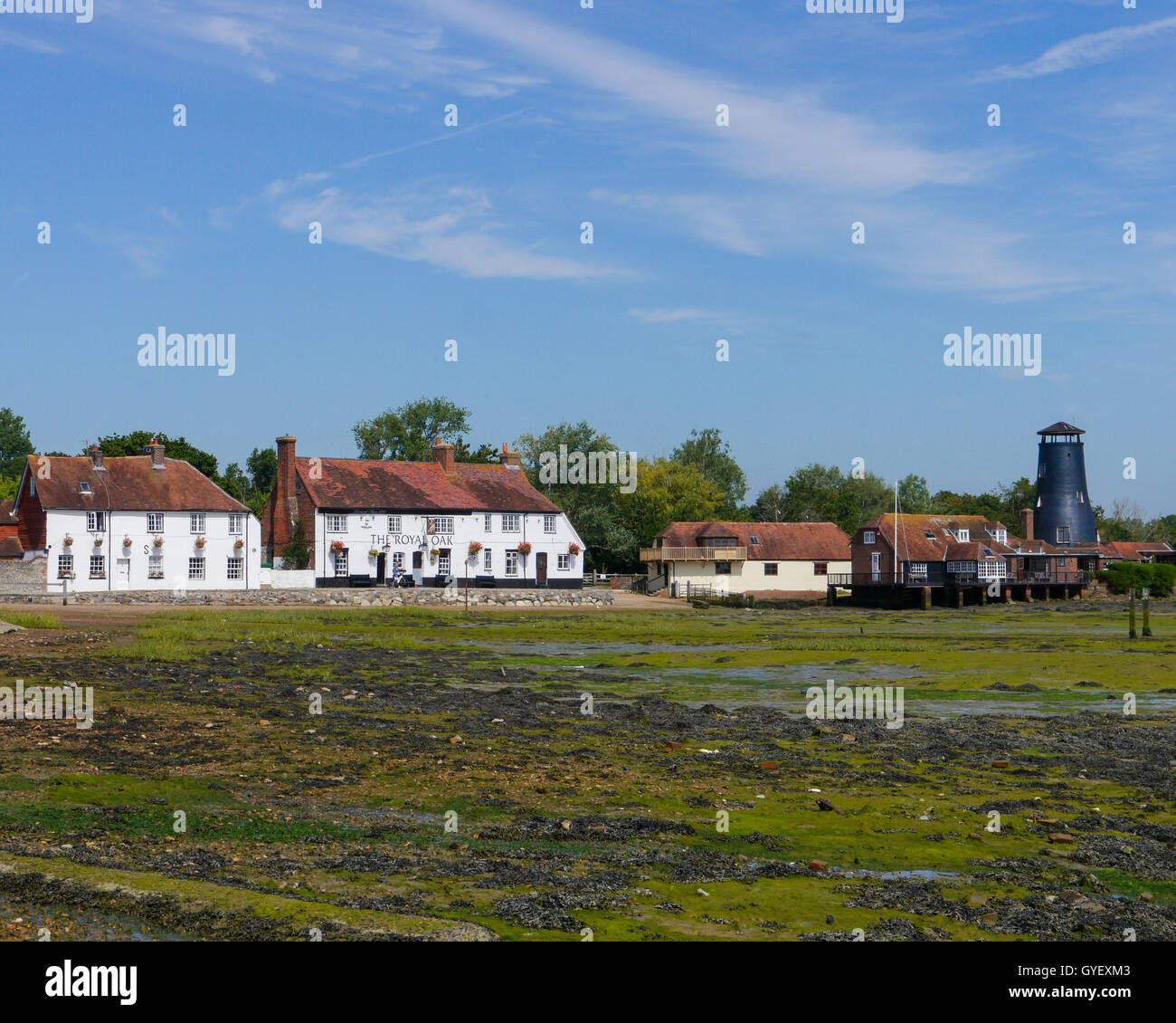 The Royal Oak public house and Langstone mill as seen from the coastal path of Langstone High Street, Hampshire, England Stock Photo