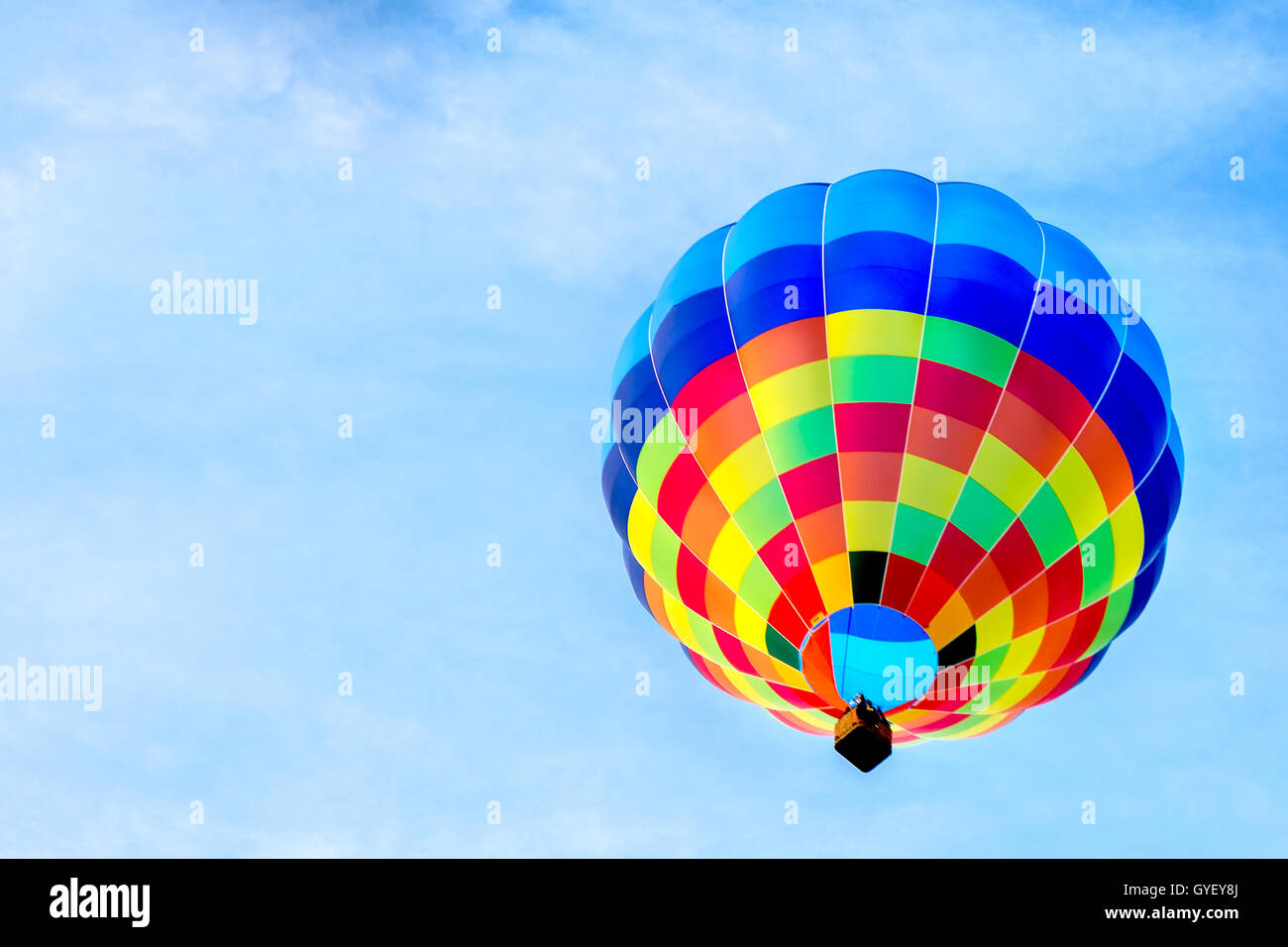 single hot air balloon colorful blue sky background fly Stock Photo - Alamy
