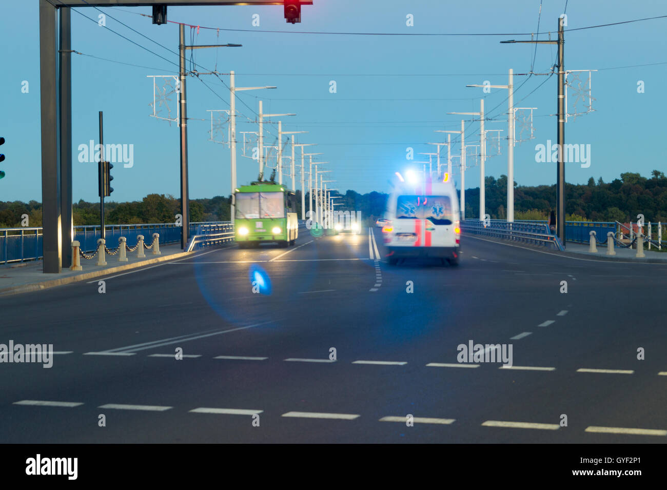 Fast ambulance using lights and sirens Stock Photo Alamy