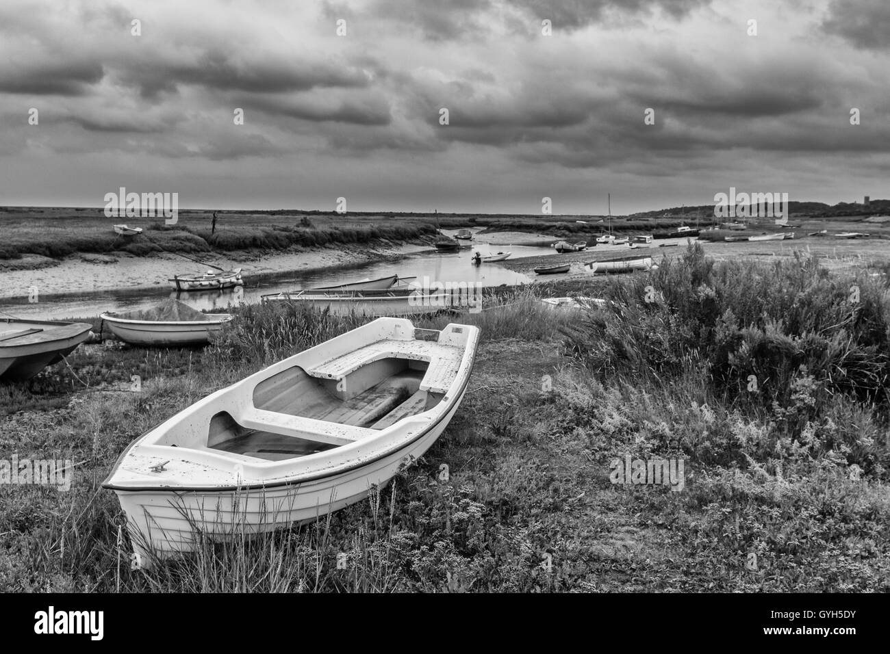 Boats moored at Blakeney Harbour in Norfolk Stock Photo