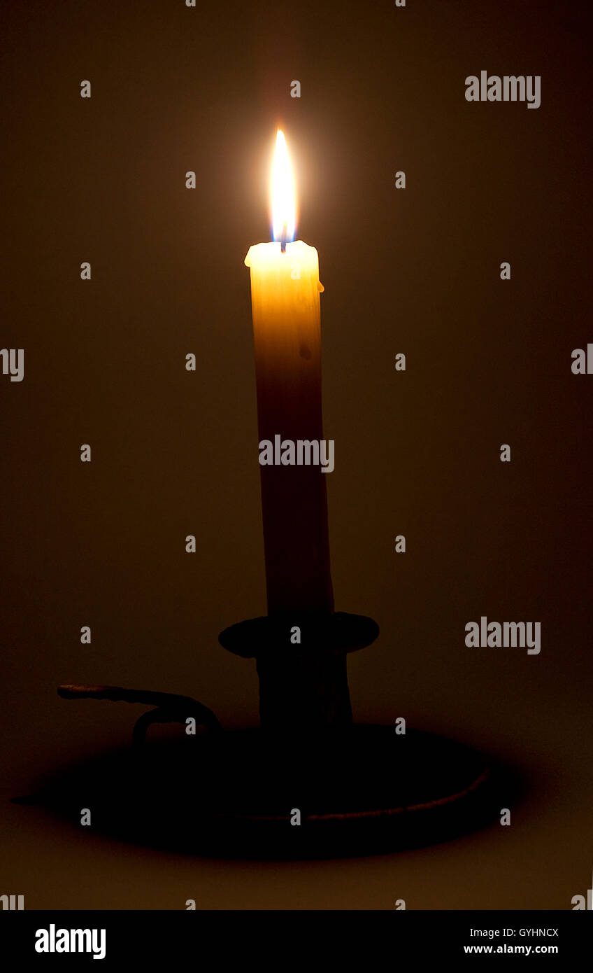Glowing candle Stock Photo Alamy