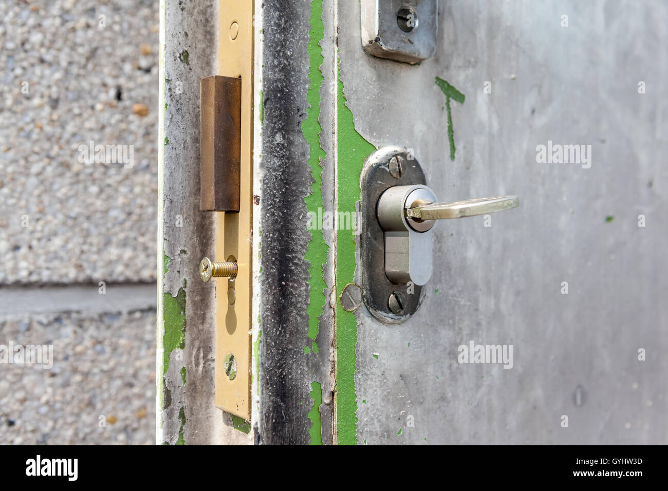 Old metal door with a lock case and cylinder Stock Photo - Alamy