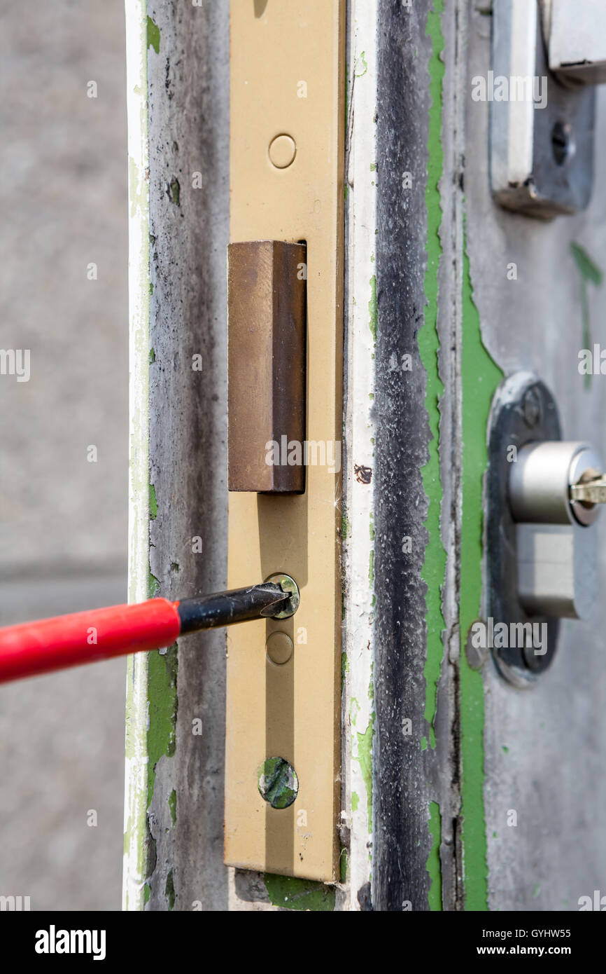 Old metal door with a lock case and cylinder Stock Photo - Alamy
