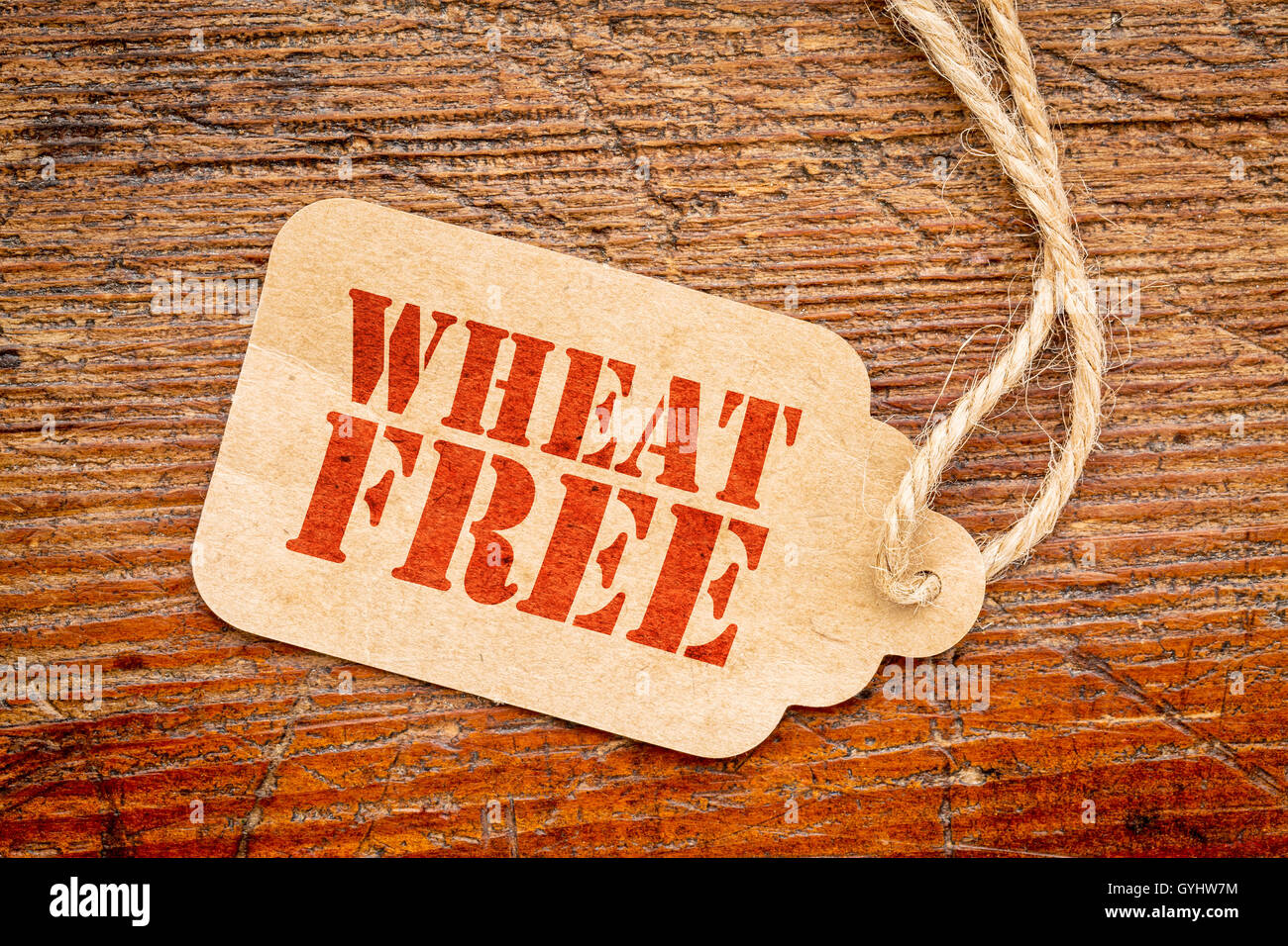 wheat free sign a paper price tag against rustic red painted barn