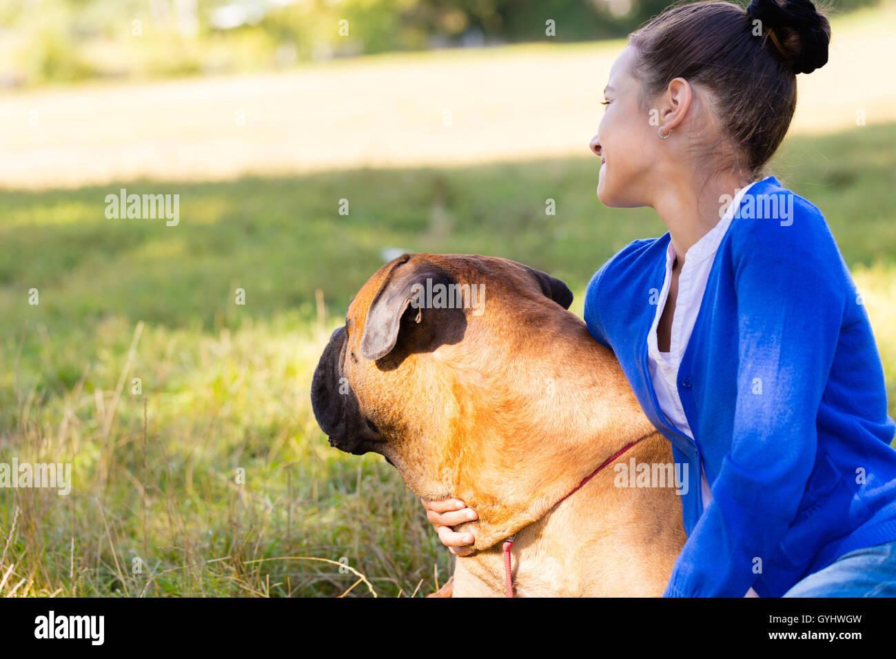 teen girl with the dog Bullmastiff outdoors Stock Photo