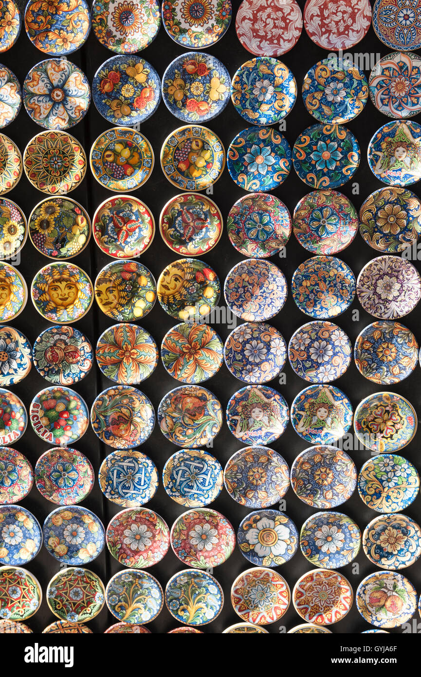 Board of traditional Sicilian hand painted plates for sale outside in the sun Stock Photo