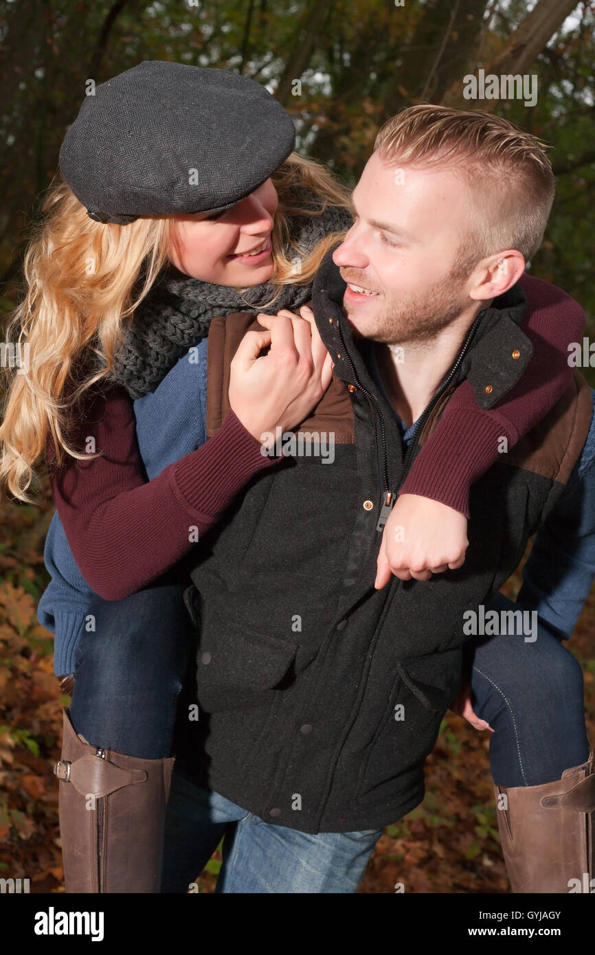 Happy couple in the forest Stock Photo - Alamy