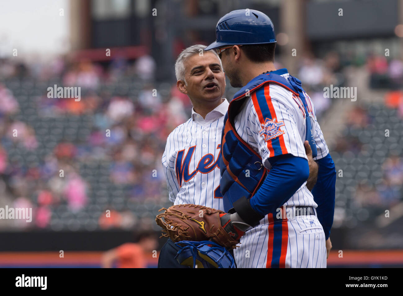 Mayor of London Sadiq Khan pitches the first ball at a baseball game between New York Mets and Minnesota Twins at Citi Field in New York City, during a three day visit to the US capital as part of his visit to North America, where he is due to meet NYC Mayor Bill de Blasio. Stock Photo