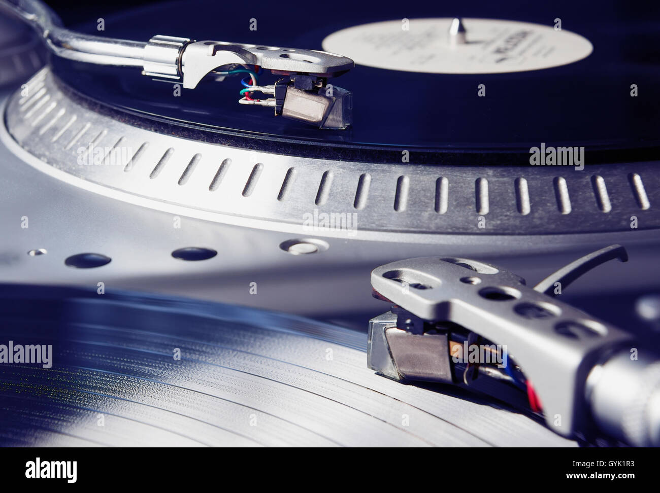 Turntable player with musical vinyl record. Useful for DJ, nightclub and retro theme. Stock Photo