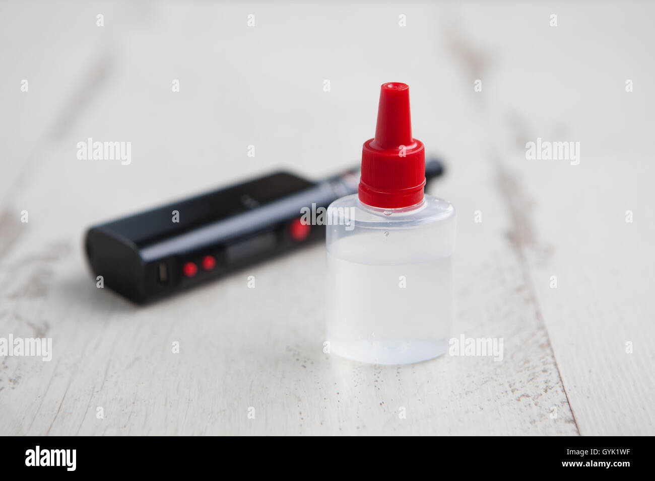 vape juice shops Refill with e-juice or liquid with salt nicotine of replacement cartridge  for vape pod or new vape pen device — Stock Photo © DedMityay #311442702 main image 0