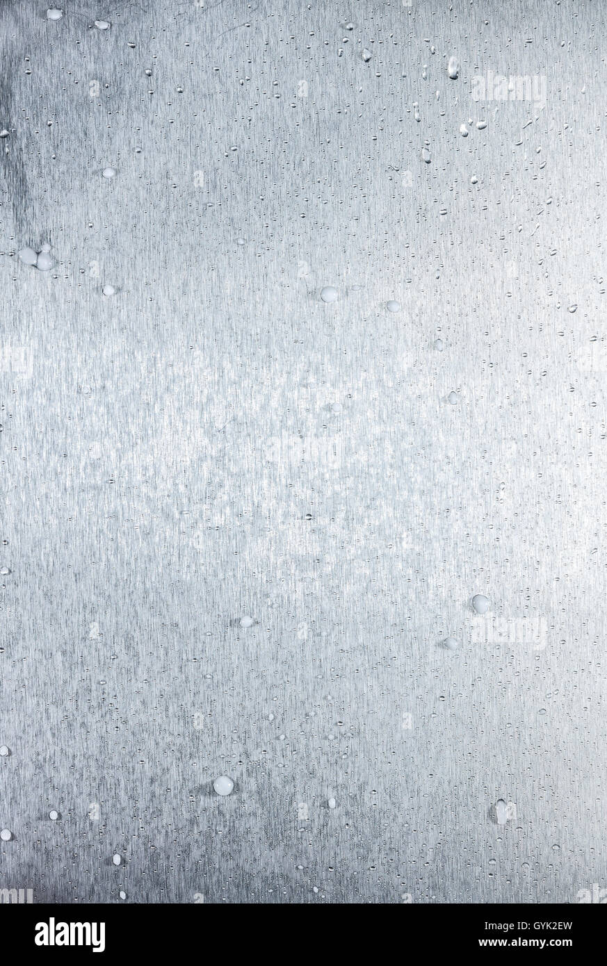 aluminum metal surface frozen with small ice crystals and drops Stock