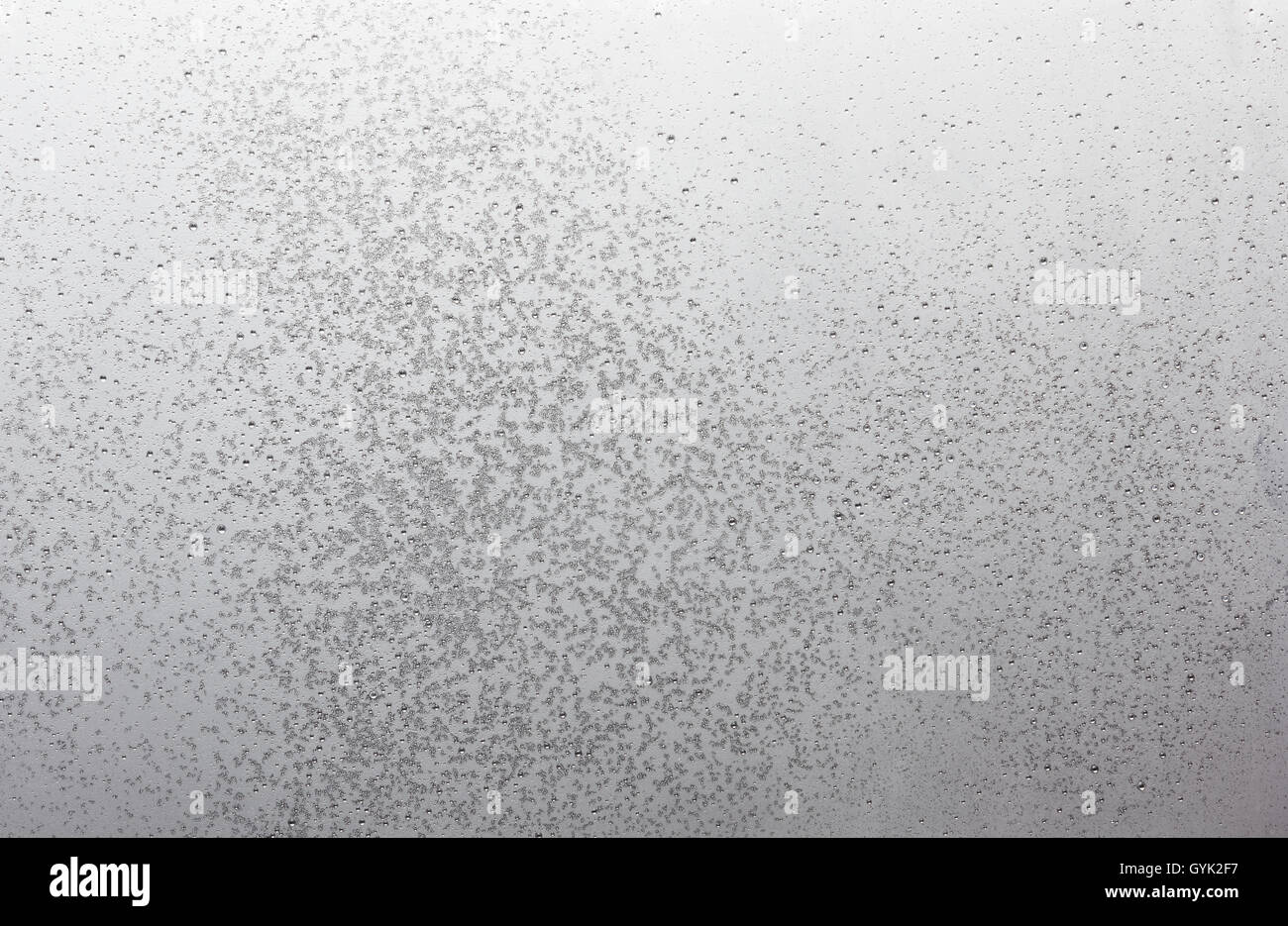 aluminum metal surface frozen with small ice crystals and drops, high