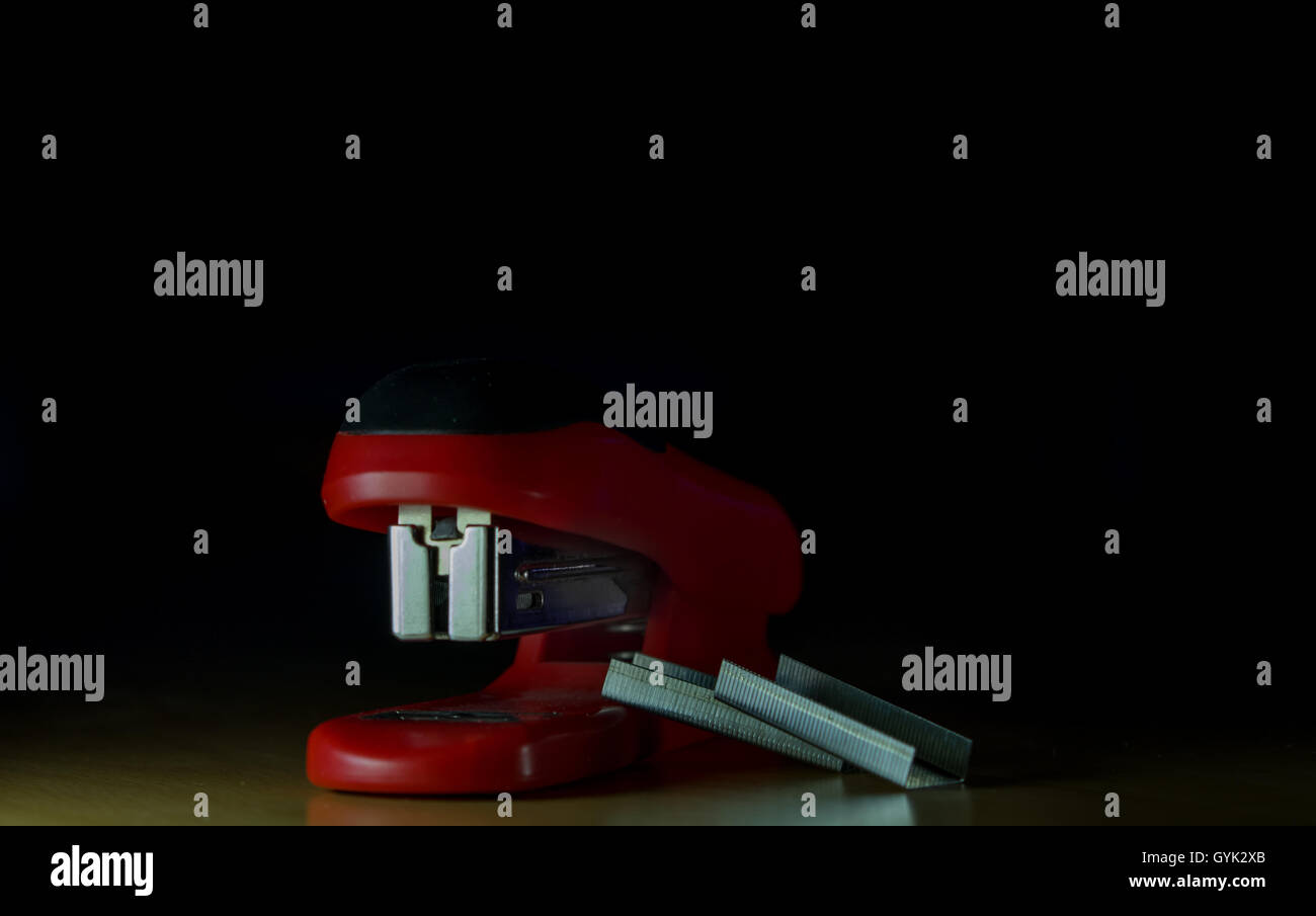 Stapler with bullets Stock Photo - Alamy