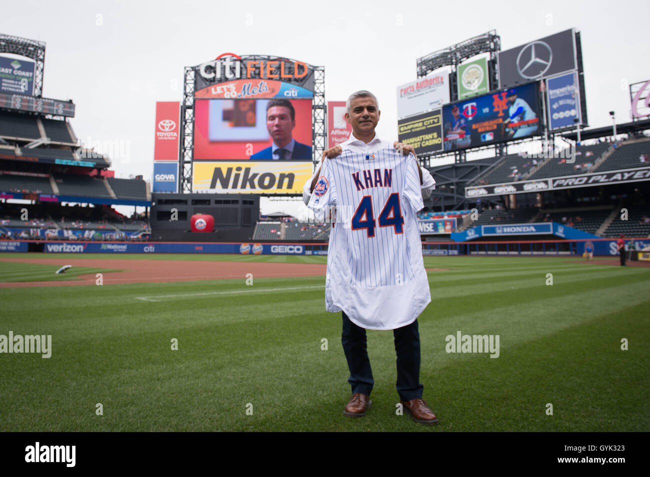 Mayor of London Sadiq Khan holds a shirt with his name on as he arrives to pitch the first ball at a baseball game between the New York Mets and Minnesota Twins at Citi Field in New York City (NYC) during a three day visit to the US capital as part of his visit to North America. Stock Photo