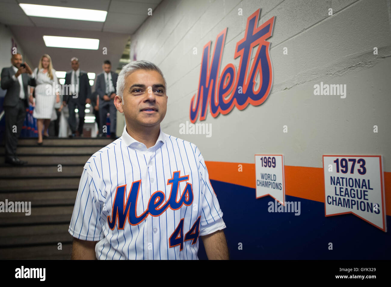 Mayor of London Sadiq Khan wears a shirt with his name on as he arrives to pitch the first ball at a baseball game between the New York Mets and Minnesota Twins at Citi Field in New York City (NYC) during a three day visit to the US capital as part of his visit to North America. Stock Photo