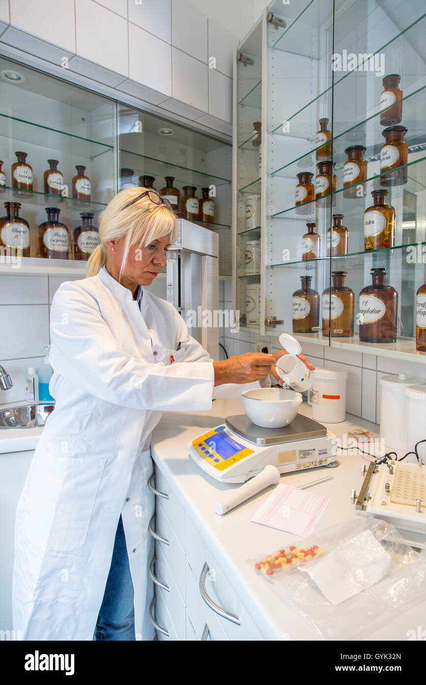 Pharmacy, pharmacist produces an individual drug for a patient, in the laboratory of the pharmacy, Stock Photo