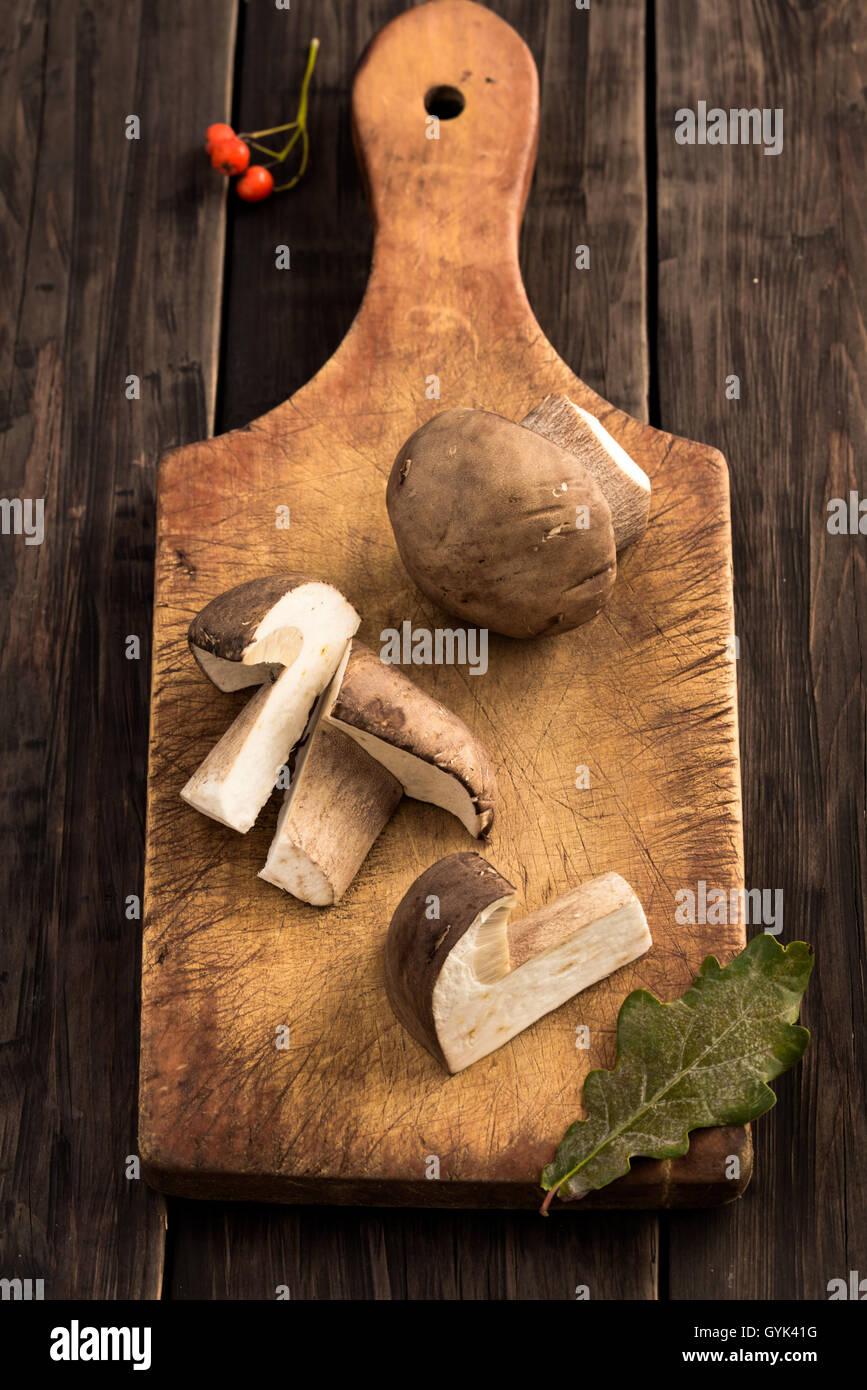 Sliced cep mushrooms on cutting board Stock Photo