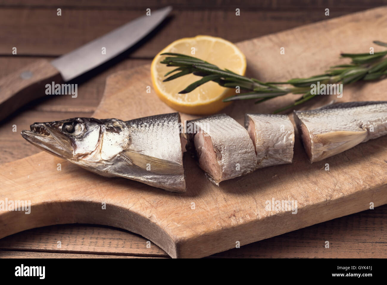 Sliced smoked fish and lemon Stock Photo Alamy
