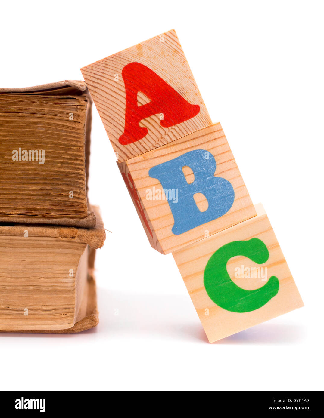 Alphabet letter ABC blocks for kids and old books Stock Photo