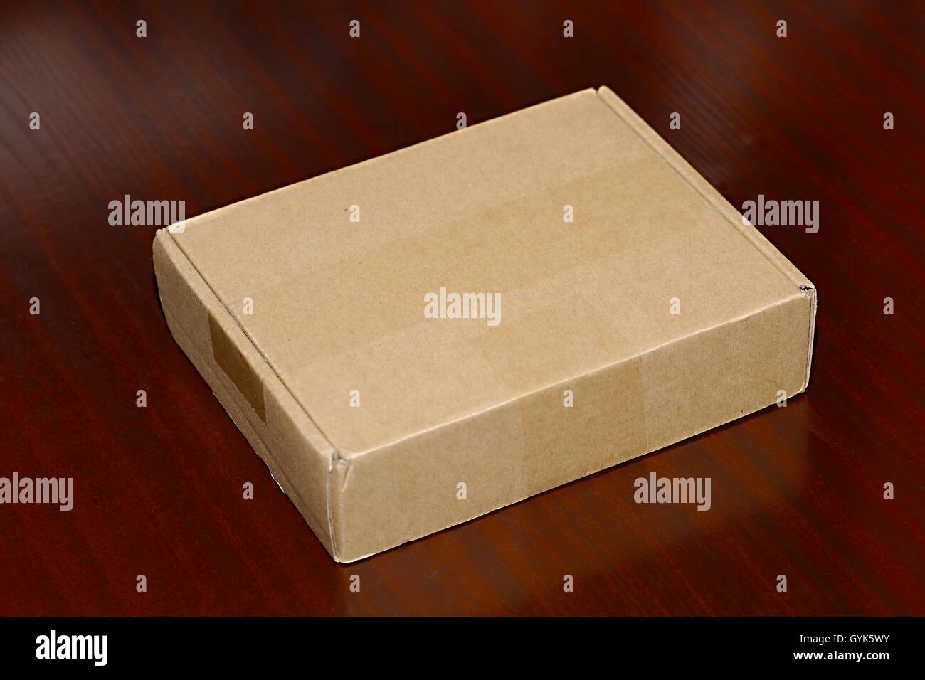 Cardboard Box on Desk Stock Photo