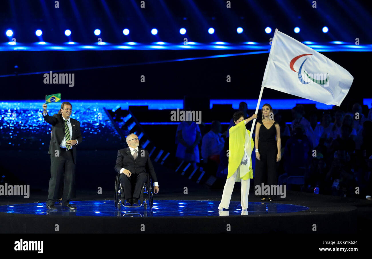 The Mayor of Rio de Janeiro Eduardo Paes (left) applauds as President of the IPC Sir Philip Craven (centre) hands the Paralympic flag to the Governor of Tokyo Yuriko Koike during the closing ceremony on the eleventh day of the 2016 Rio Paralympic Games at the Maracana, Rio de Janeiro, Brazil. PRESS ASSOCIATION Photo. Picture date: Sunday September 18, 2016. Photo credit should read: Adam Davy/PA Wire. EDITORIAL USE ONLY Stock Photo