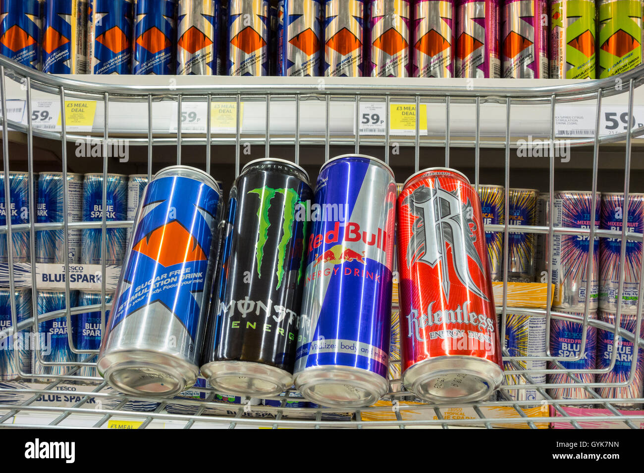 Energy drinks in shopping trolley in Tesco supermarket. UK Stock Photo