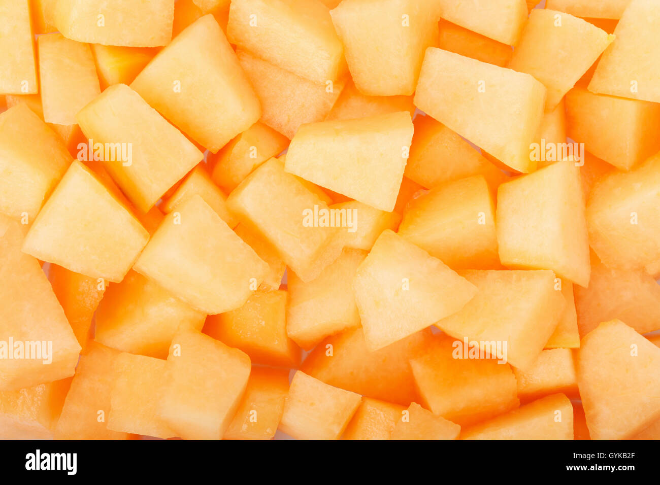 Cantaloupe melon pieces texture background Stock Photo
