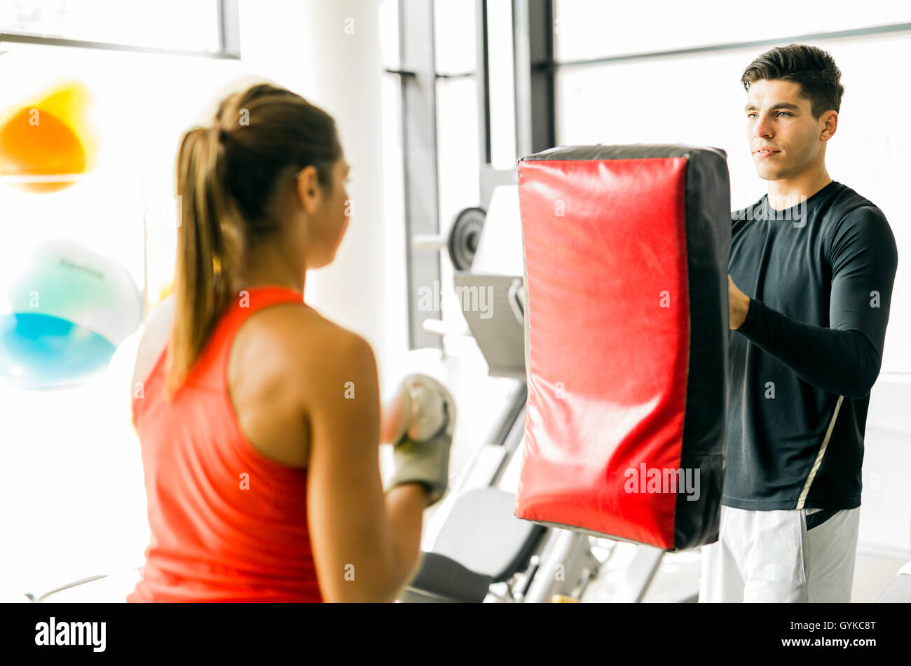 Young woman boxing and training in a gym Stock Photo