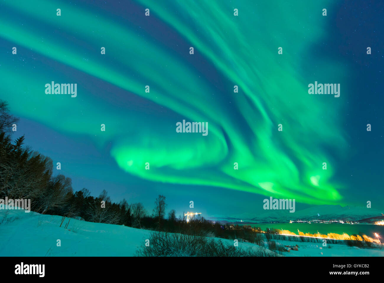 aurora eddy over island Kvaloya, Norway, Troms, Kvaloeya, Tromsoe Stock Photo