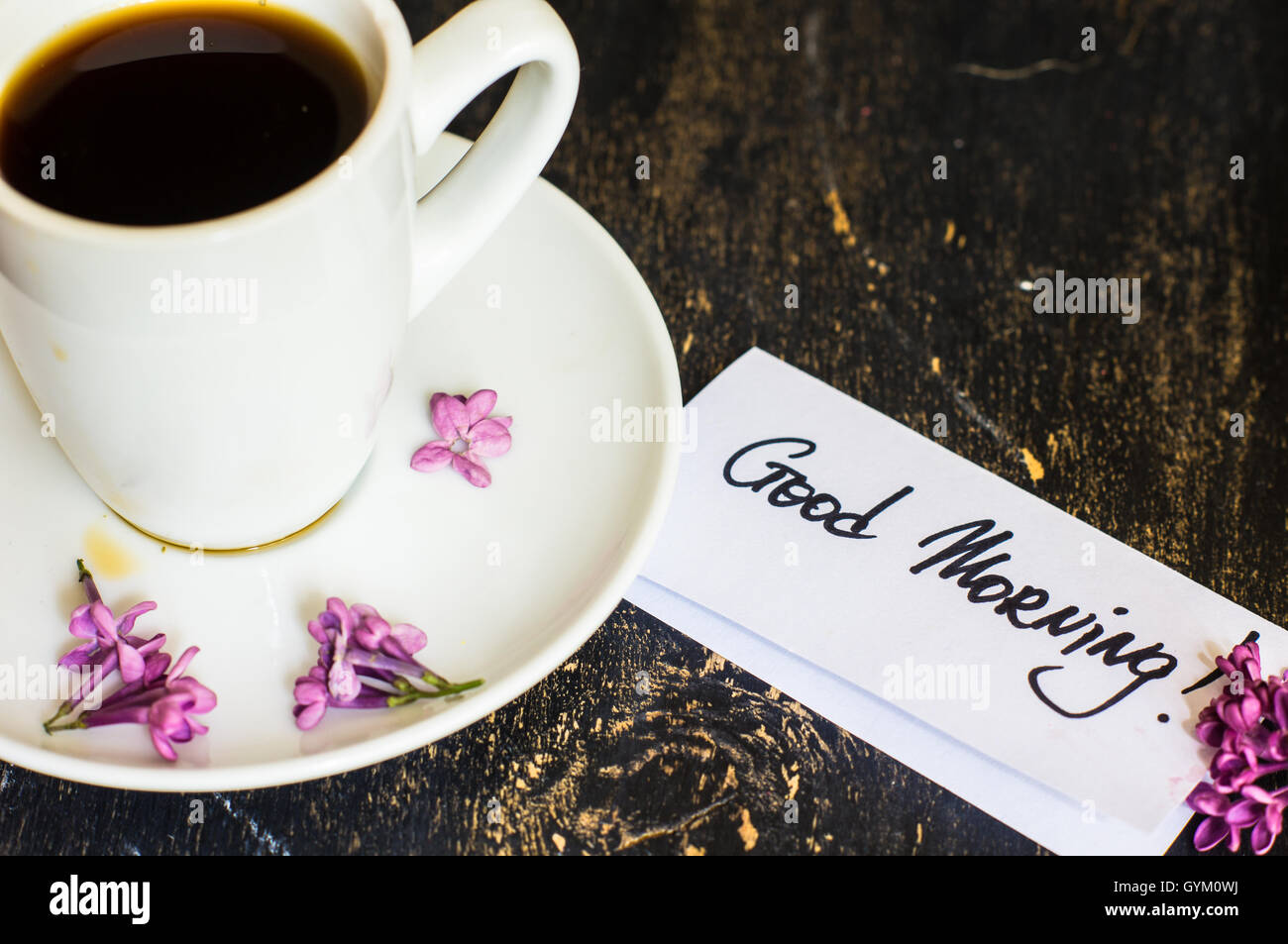 Lilac Flowers And Cup Of Coffee With Good Morning Note On Rustic