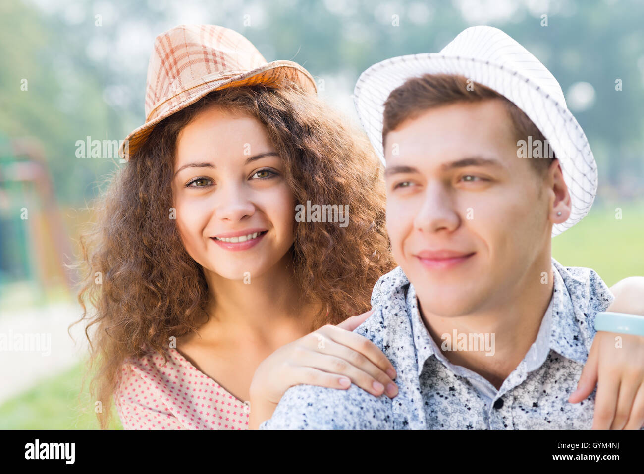 couple lying on the grass in the summer park Stock Photo - Alamy