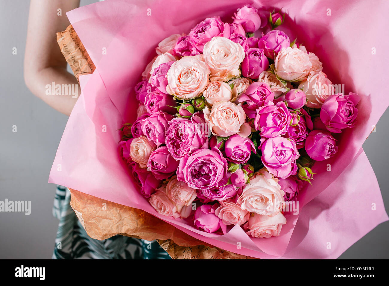 Luxury bouquets of flowers Pink Colour peonies and roses in the hands ...